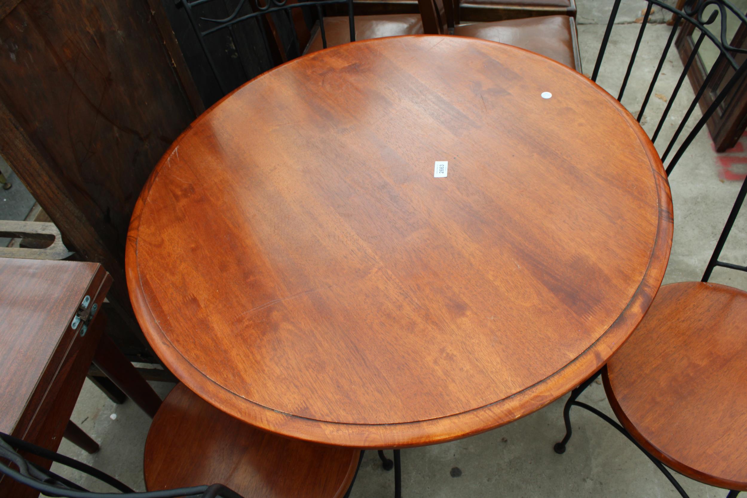 A HARDWOOD DINING TABLE ON A METALWARE BASE 36" DIAMETER AND FOUR MATCHING CHAIRS - Image 4 of 4