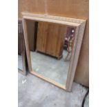 A GILT EFFECT BEVEL EDGE WALL MIRROR 48" X 37"