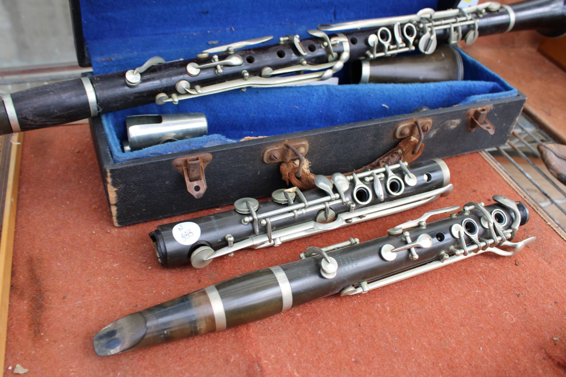 A BELIEVED COMPLETE VINTAGE JACQUES ALBERT CLARINET WITH CARRY CASE AND AN ASSORTMENT OF BOOZY - Image 2 of 3