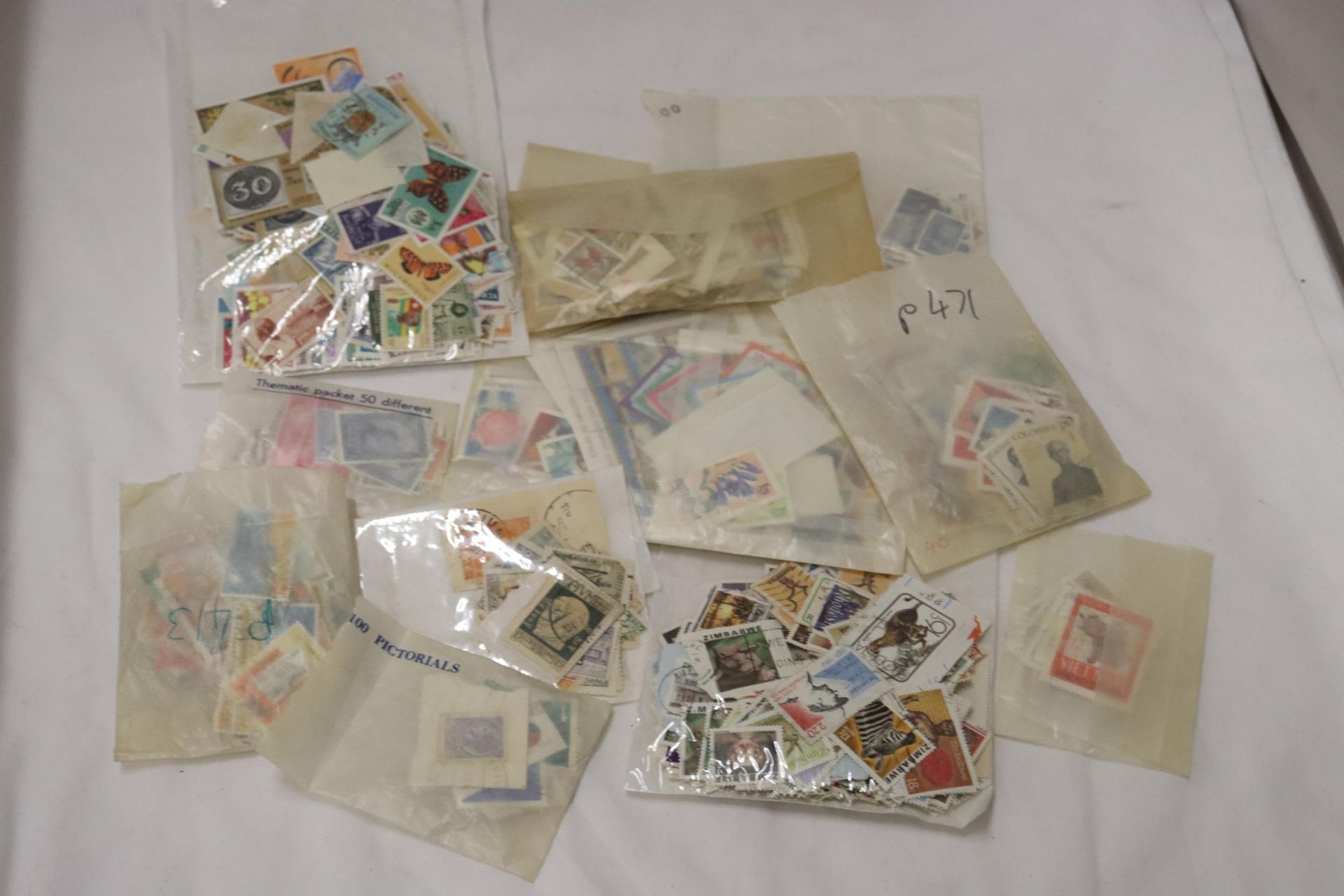 A COLLECTION OF STAMPS IN PACKETS