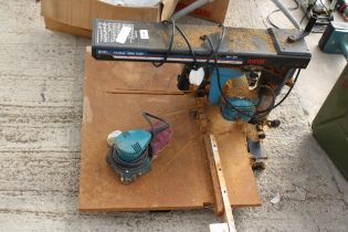 A RYOBI RADIAL ARM SAW AND A PALM SANDER