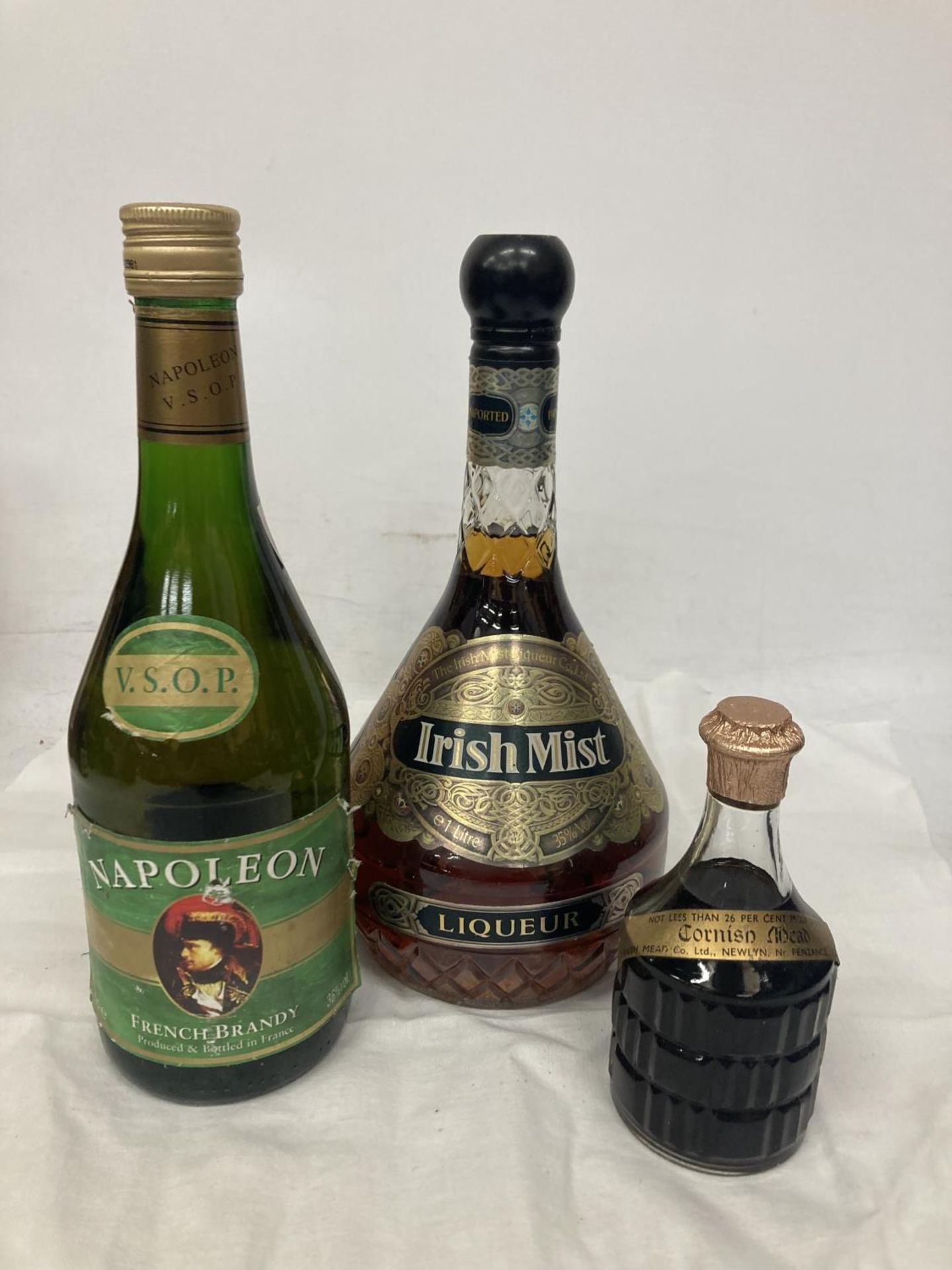 THREE MIXED BOTTLES - VSOP NAPOLEON, CORNISH MEAD AND IRISH MIST LIQUEUR