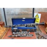 A BELIEVED COMPLETE VINTAGE JACQUES ALBERT CLARINET WITH CARRY CASE AND AN ASSORTMENT OF BOOZY