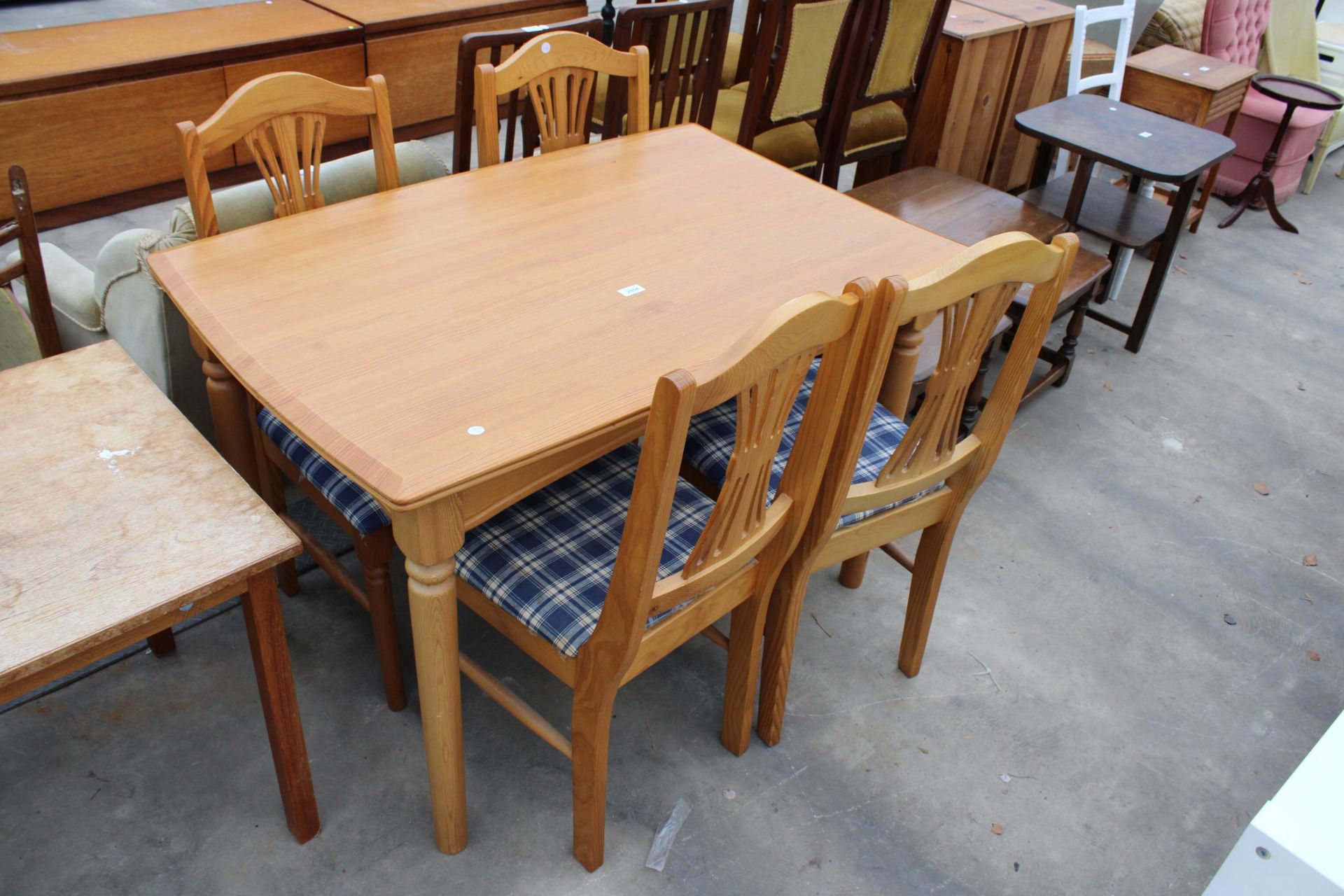 A PINE DINING TABLE 45" X 29" AND FOUR CHAIRS