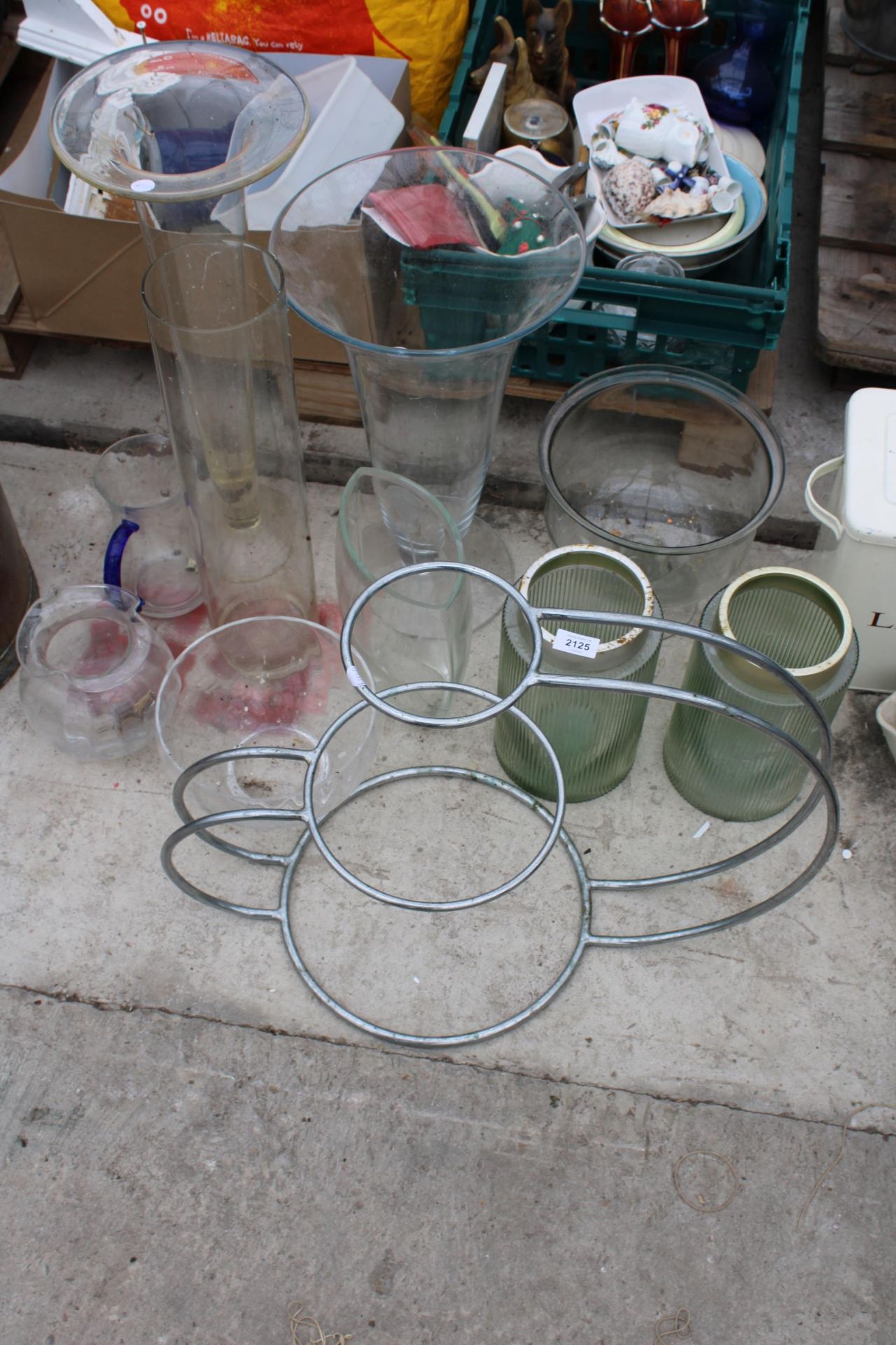 AN ASSORTMENT OF GLASS VASES AND A METAL STAND