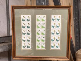 A FRAMED COLLECTION OF BELIZE STAMPS FEATURING BIRDS AND BUTTERFLIES