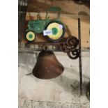 A CAST IRON JOHN DEERE TRACTOR BELL