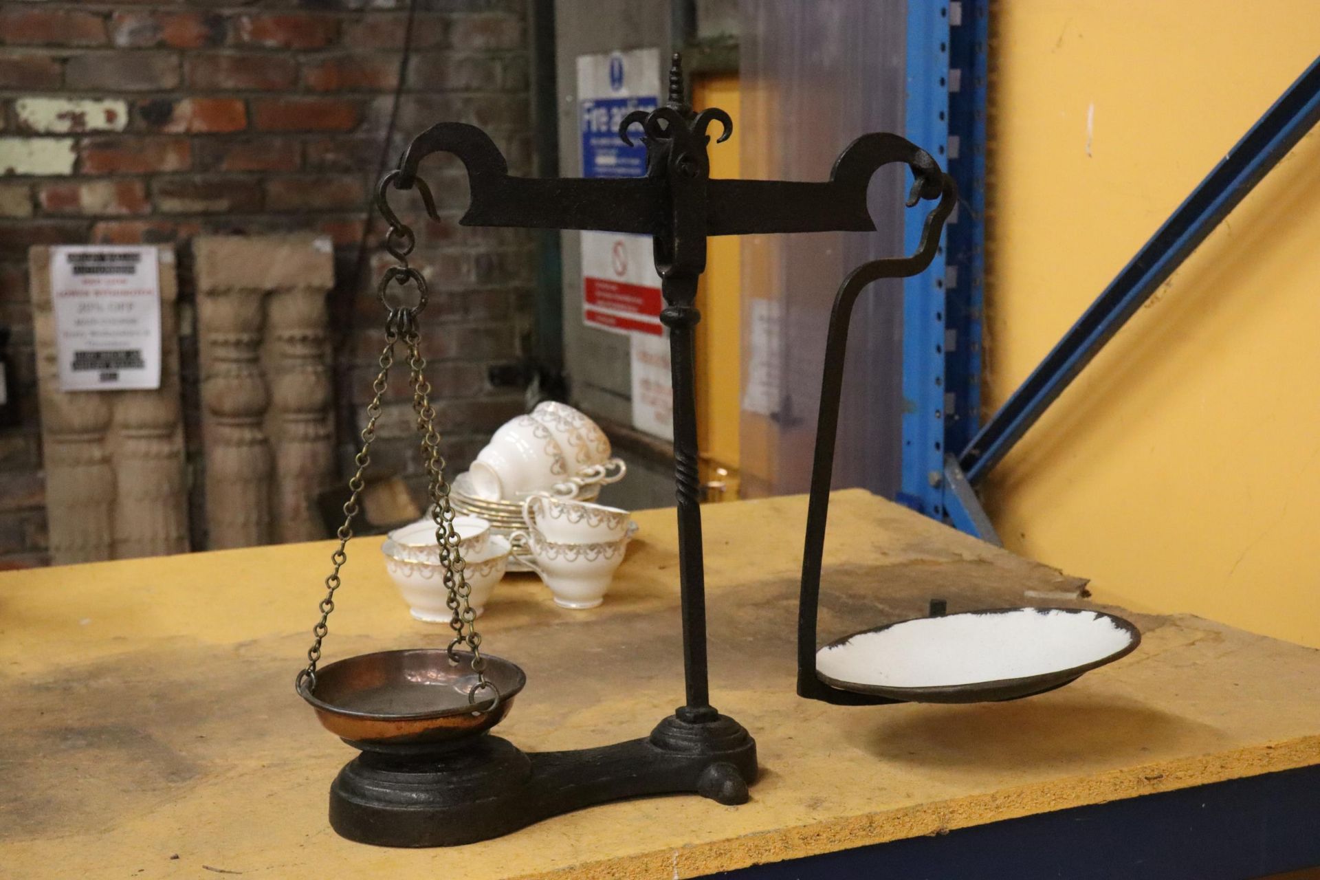 A VINTAGE SET OF CAST AND BRASS BALANCE SCALES