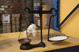 A VINTAGE SET OF CAST AND BRASS BALANCE SCALES