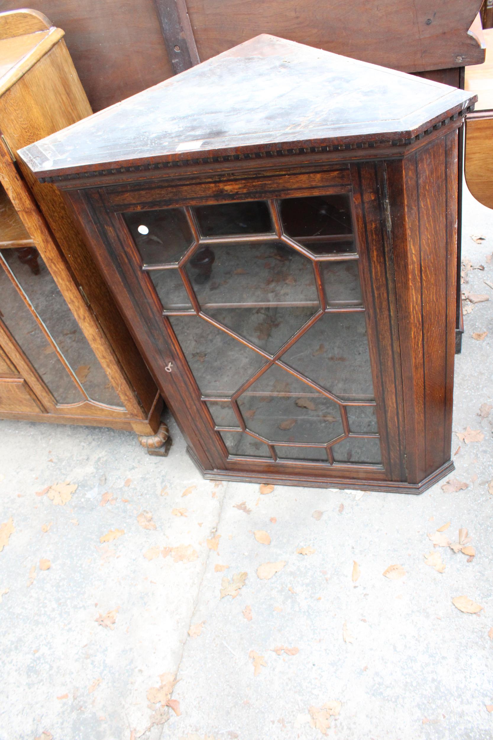 AN OAK GEORGE III STYLE ASTRAL GLAZED CORNR CUPBOARD