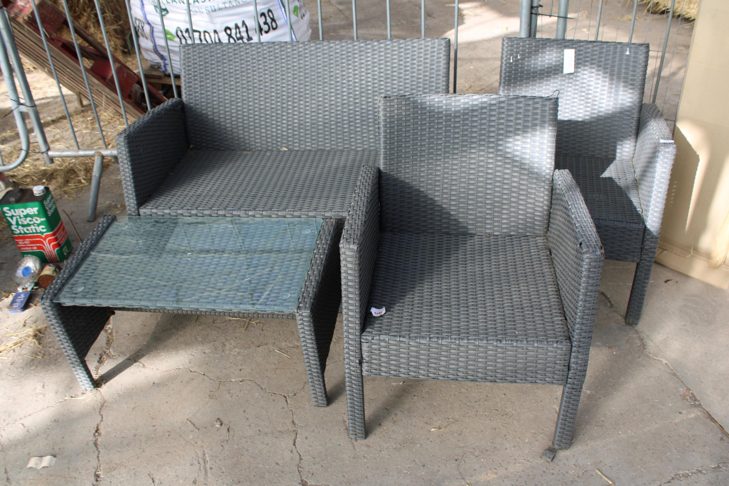 A RATTAN GARDEN FURNITURE SET COMPRISING OF A TWO SEATER BENCH, TWO CHAIRS AND A COFFEE TABLE