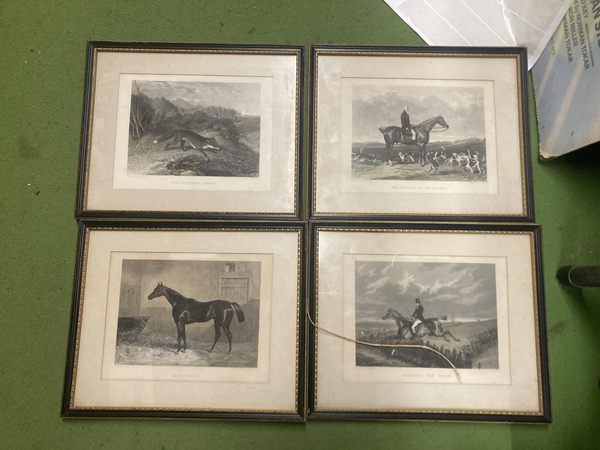 A SET OF FOUR HUNTING SCENCE RELATED ENGRAVED PRINTS TO INCLUDE, CLEARING THE FENCE, FOX BREAKING