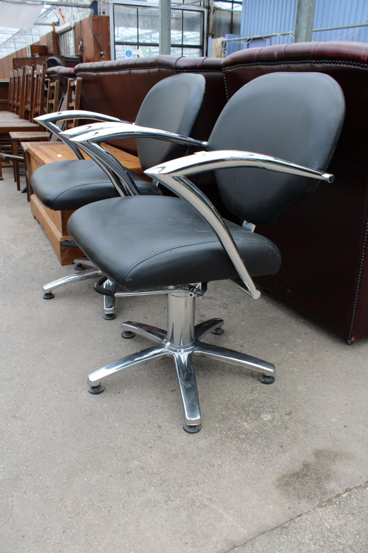 A PAIR OF BLACK FAUX LEATHER BARBERS STYLE SWIVEL PUMP CHAIRS ON POLISHED CHROME BASE WITH SWEPT - Image 2 of 2