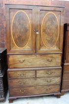 A NINETEENTH CENTURY MAHOGANY AND INLAID PRESS SECRETAIRE WITH TWO SHAM AND TWO LONG DRAWERS TO