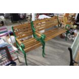 A WOODEN SLATTED GARDEN BENCH AND CHAIR BOTH WITH CAST ENDS