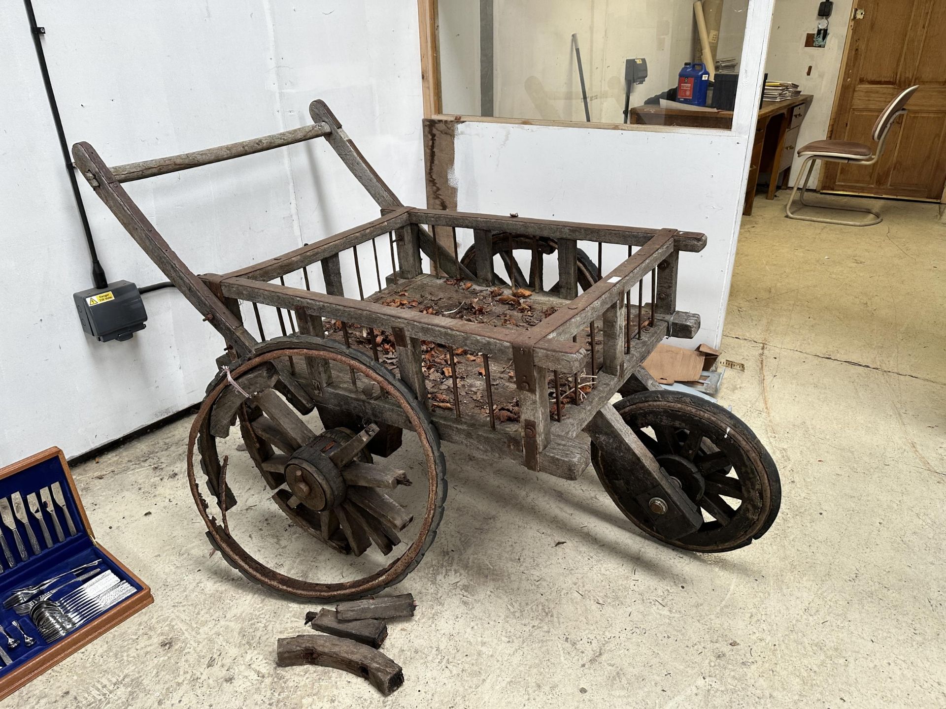 A VINTAGE INDIAN THREE WHEELED HAND CART (ONE WHEEL REQUIRES REPAIR)