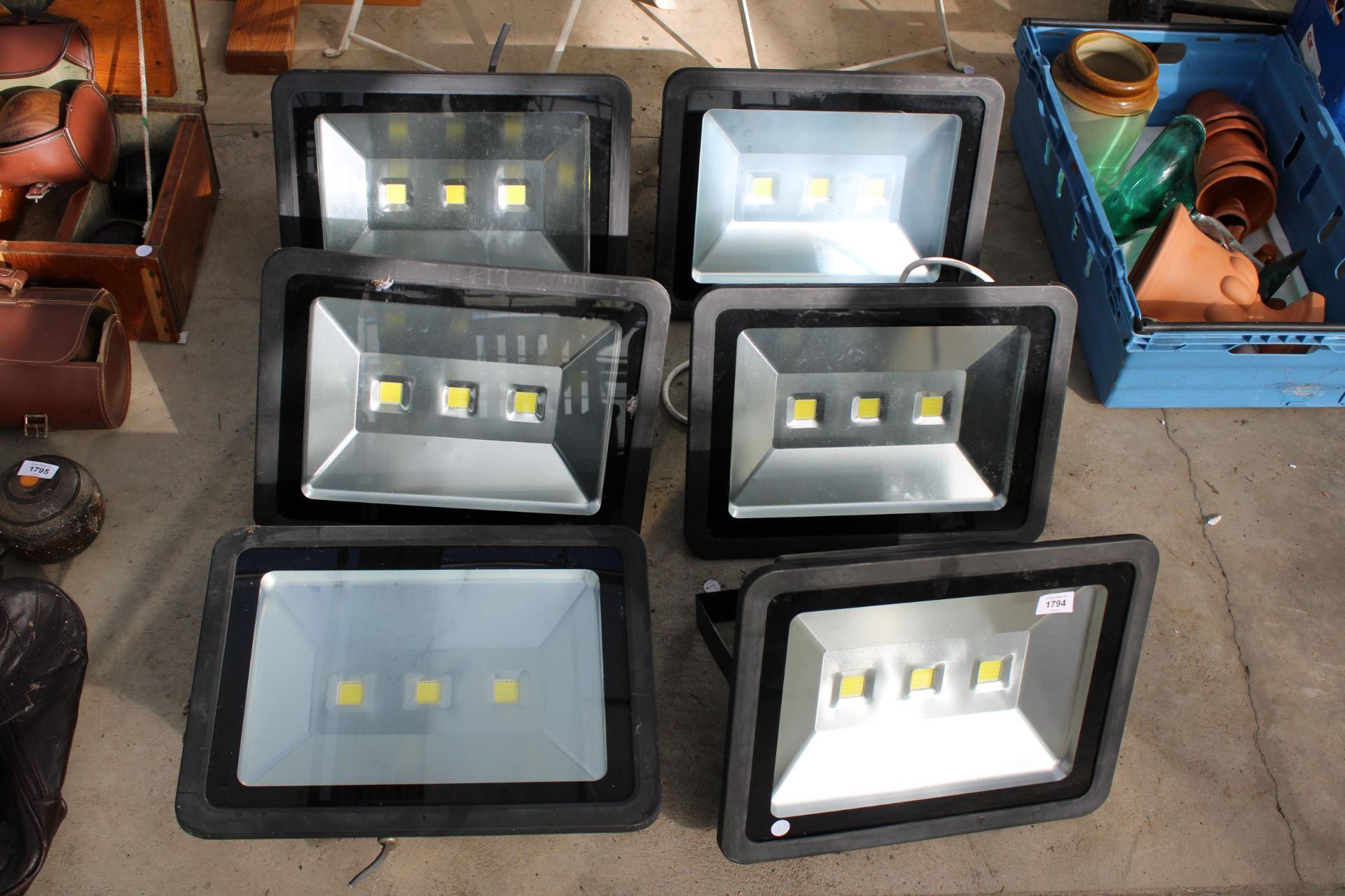 A SET OF SIX HEATHFIELD LED FLOOD LIGHTS BELIEVED IN WORKING ORDER BUT NO WARRANTY