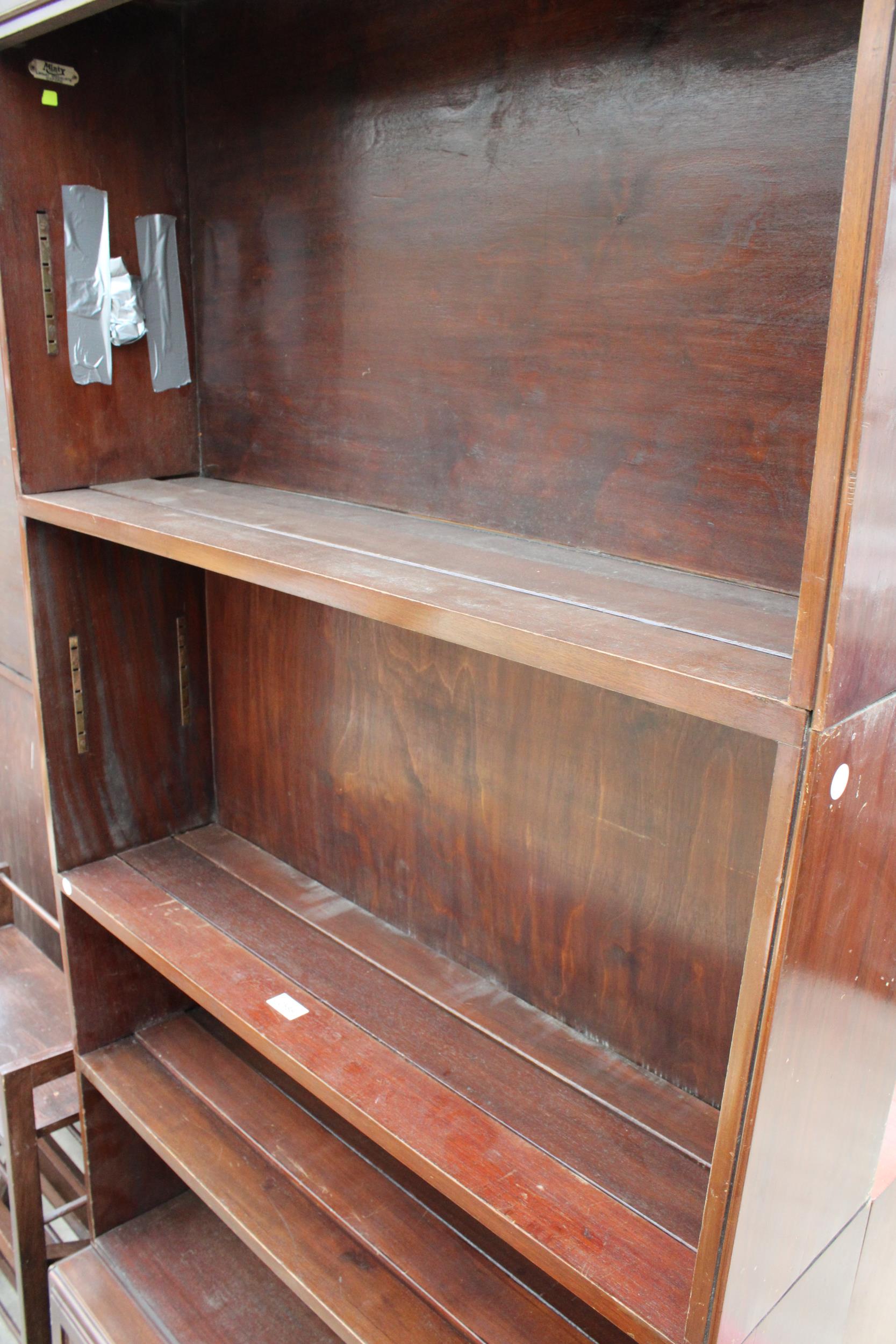 A MID 20TH CENTURY FOUR TIER SECTIONAL MINTY BOOKCASE WITH CUPBOARDS TO BASE 35" WIDE - Image 2 of 3