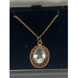 A 9 CARAT GOLD NECKLACE IN A PRESENTATION BOX