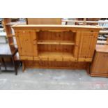 A PINE DRESSER RACK ENCLOSING CUPBARDS AND DRAWERS, 72" WIDE