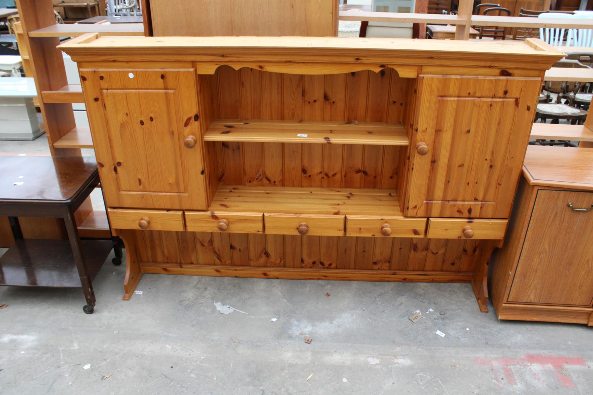 A PINE DRESSER RACK ENCLOSING CUPBARDS AND DRAWERS, 72" WIDE