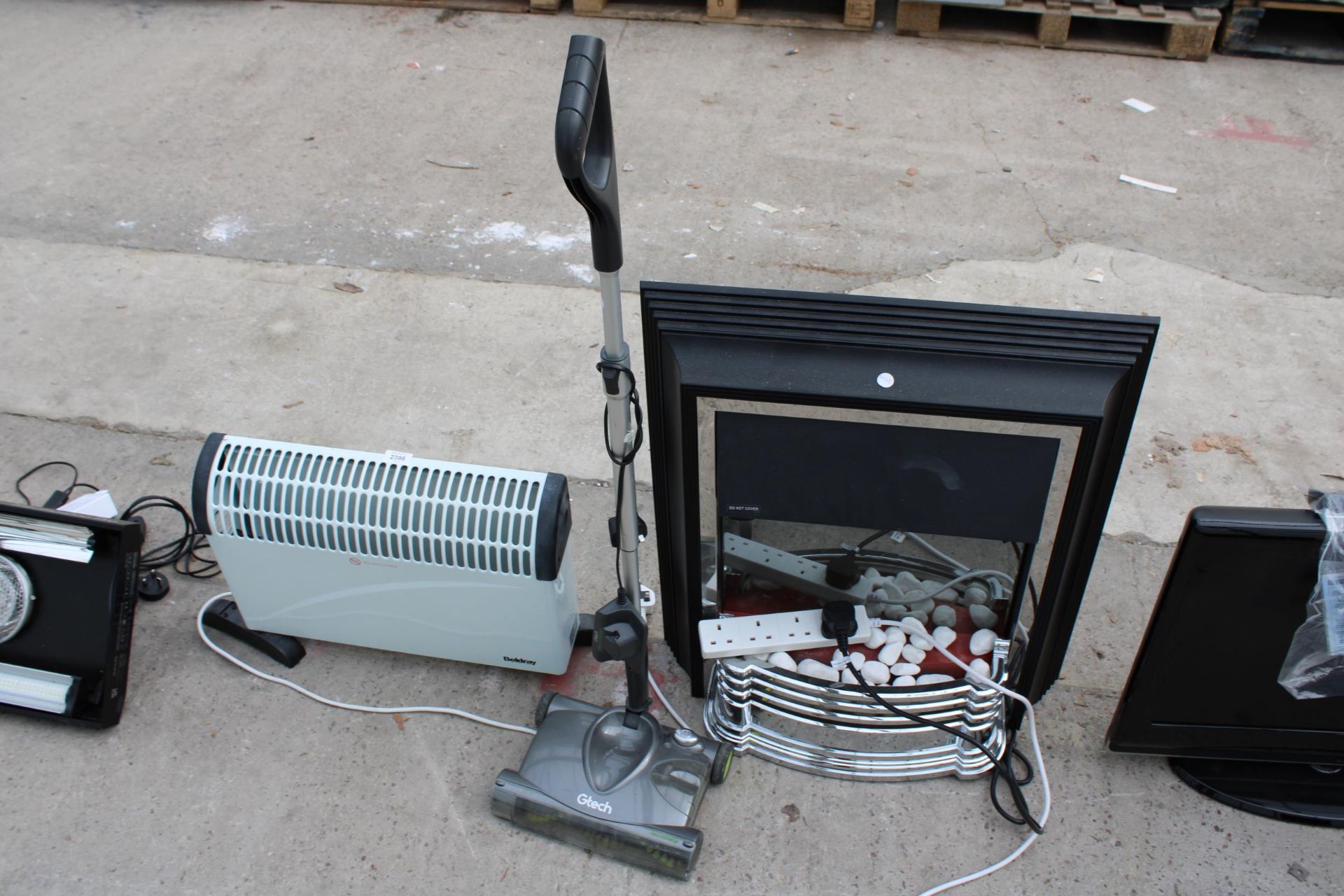 THREE ITEMS TO INCLUDE A HEATER, G TECH CORDLESS AND AN ELECTRIC FIRE