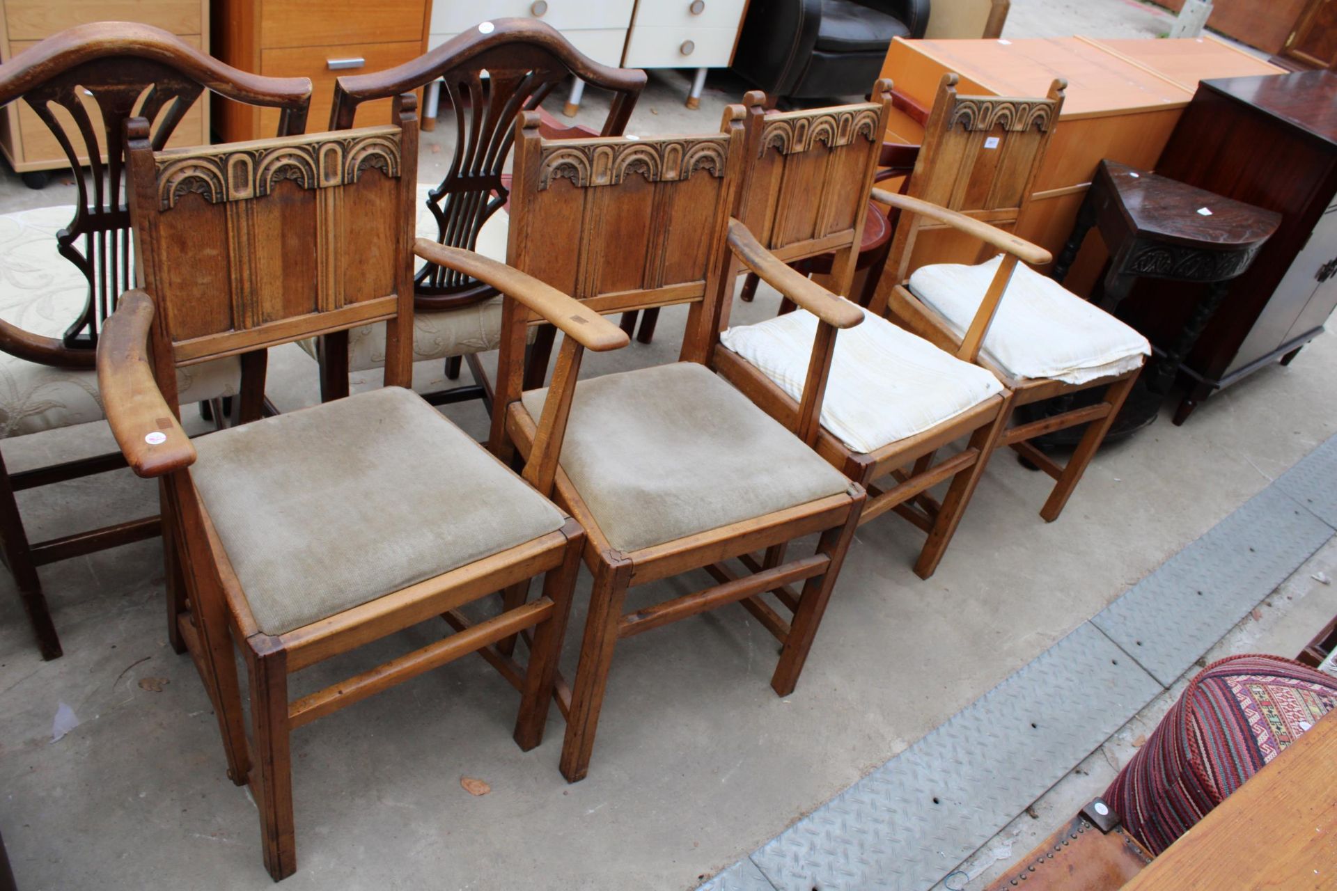 FOUR JAMES PHILLIPS AND SON OAK ARTS AND CRAFTS STYLE CHAIRS TWO BEING CARVERS