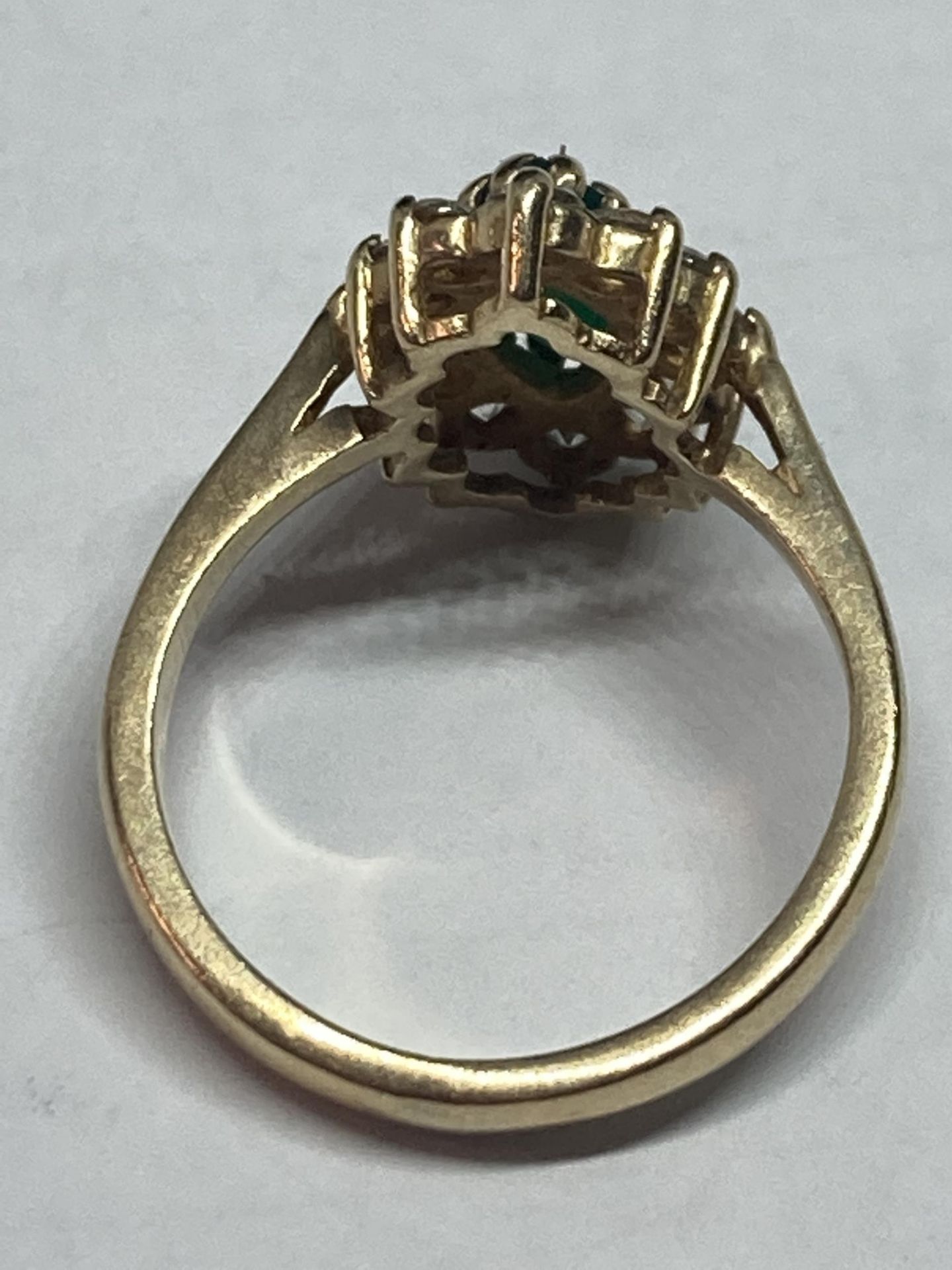 A 9 CARAT GOLD RING WITH A CENTRE EMERALD SURROUNDED BY CUBIC ZIRCONIAS SIZE L - Image 3 of 4