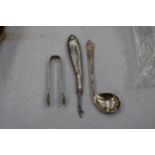 THREE MARKED SILVER ITEMS TO INCLUDE A GOLF CLUB SHAPED SPOON, SUGAR TONGS AND A MANICURE TOOL