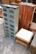 A TWO TIER WICKER LAMP TABLE WITH TILED TOP AND A GLASS FRONTED TWO DOOR BOOKCASE