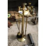 A VINTAGE BRASS COMPANION SET