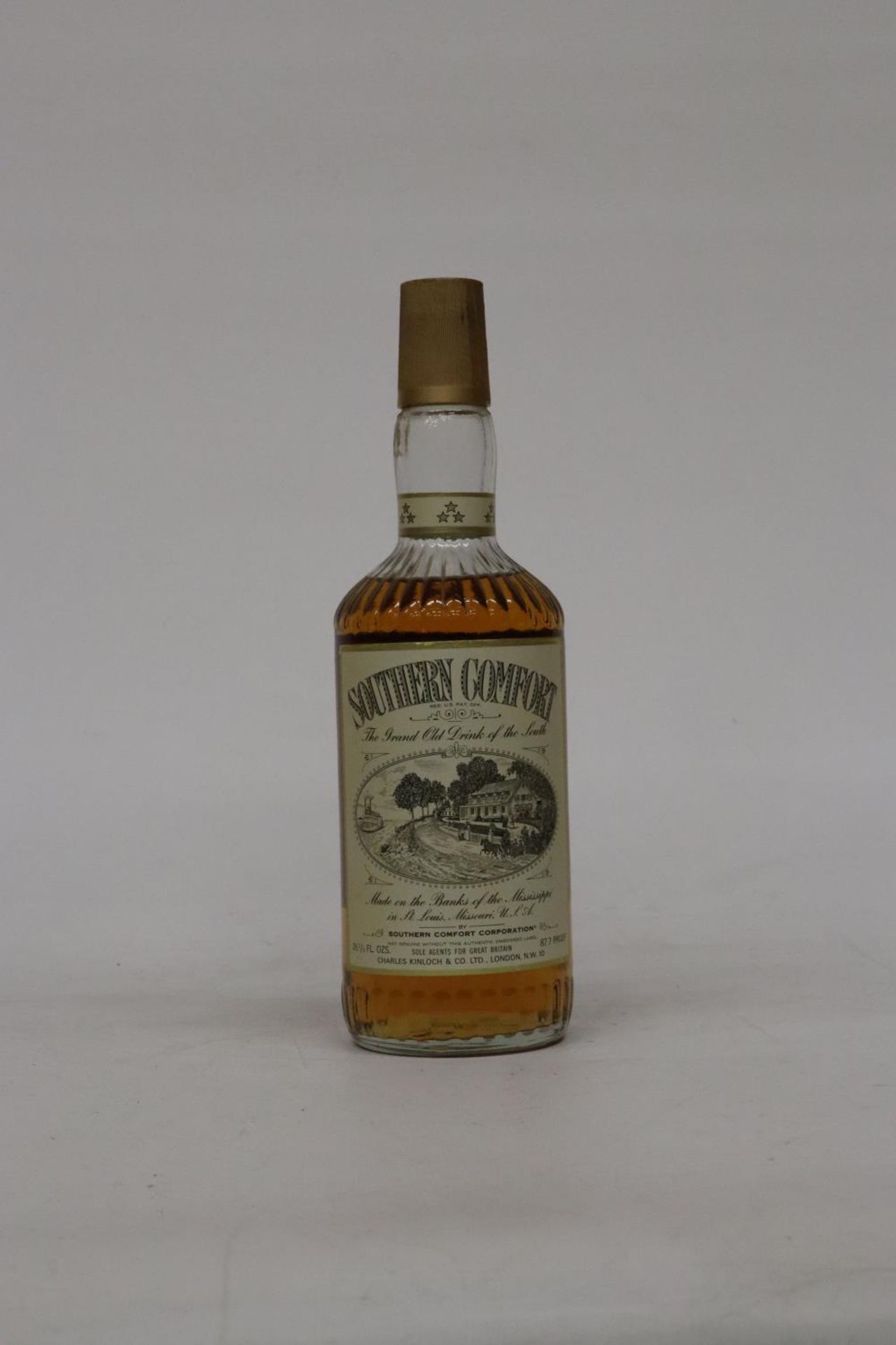 A 26 2/3 FL OZS BOTTLE OF SOUTHERN COMFORT 87.7 PROOFWHISKY