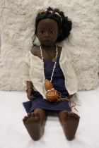 A GOTZ PSH 'PHILLIP HEATH' AFRICAN GIRL DOLL IN TRADITIONAL DRESS