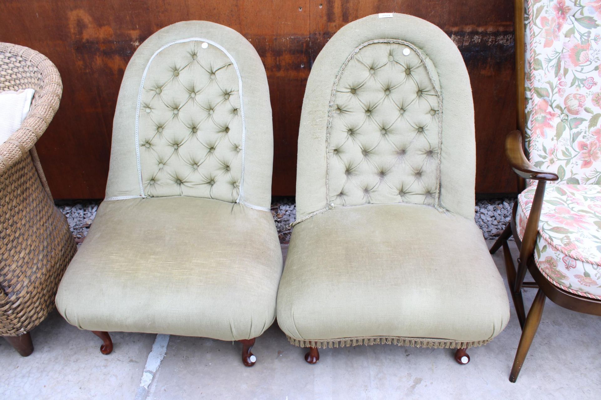 A PAIR OF HOOPED BUTTON BACK LOW UPHOLSTERED CHAIRS WITH FRONT CABRIOLE LEGS