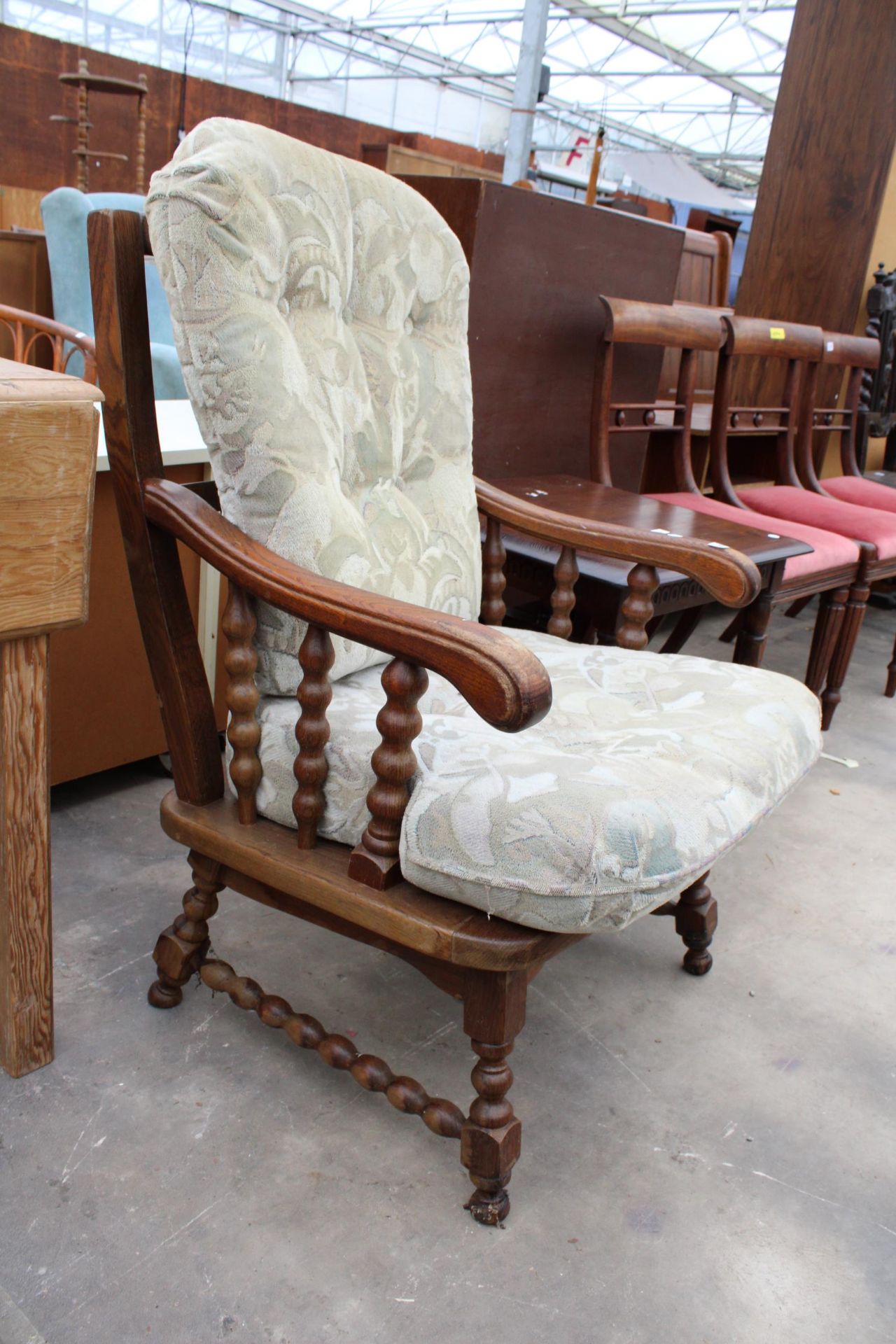 AN OAK FRAMED FIRESIDE CHAIR WITH TURNED LEGS AND UPRIGHTS - Image 2 of 2