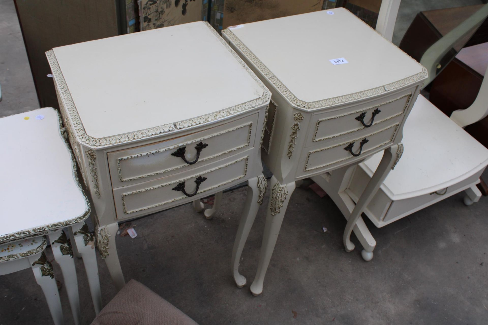 A PAIR OF CREAM AND GILT BEDSIDE TABLES, NEST OF TWO TABLES AND A POUFFE - Image 3 of 3