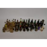 A LARGE QUANTITY OF MINIATURE BOTTLES OF ALCOHOL
