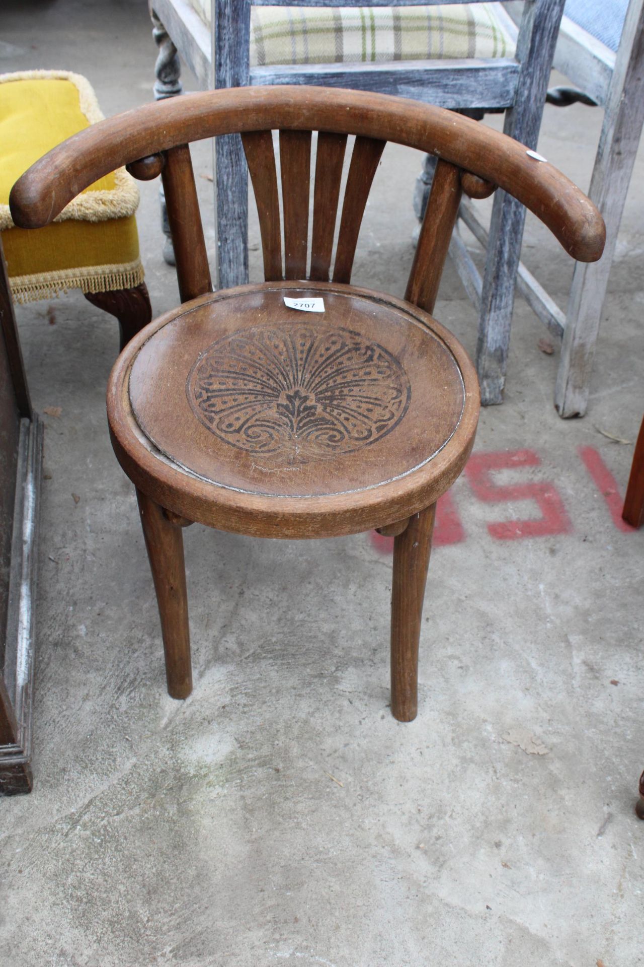 A CHILDS BENTWOOD ELBOW CHAIR