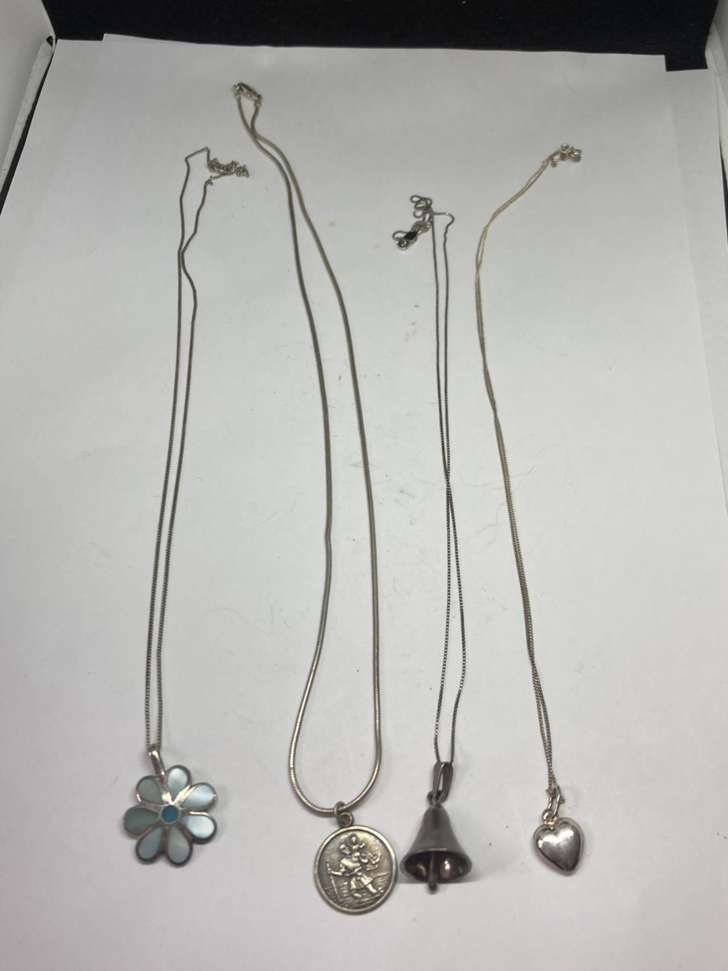 FOUR SIVER NECKLACES WITH PENDANTS
