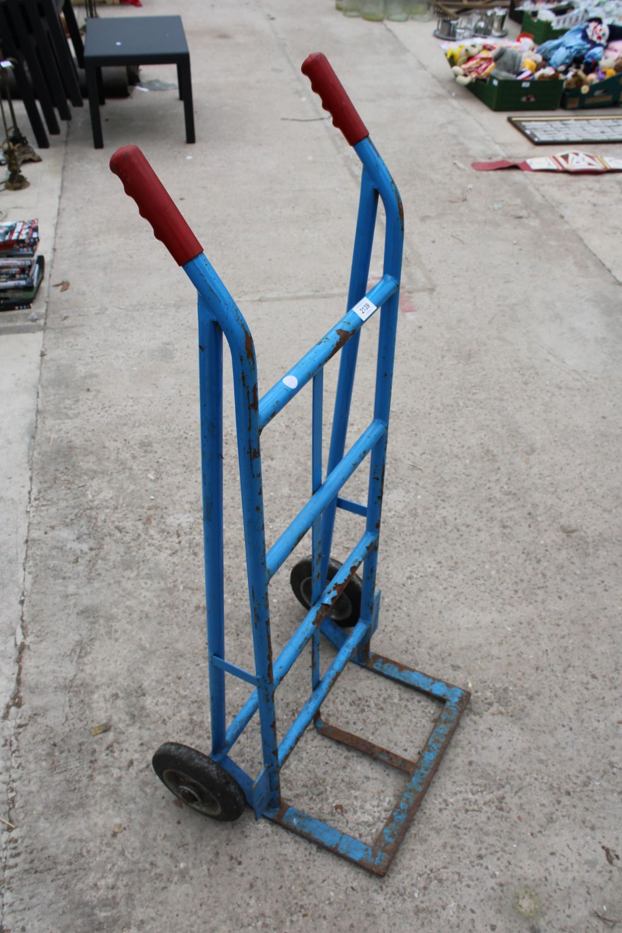 A BLUE METAL SACK TRUCK