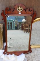 A 19TH CENTURY STYLE MAHOGANY WALL MIRROR WITH GOLD COLOURED EAGLE CARVING 41" X 24"