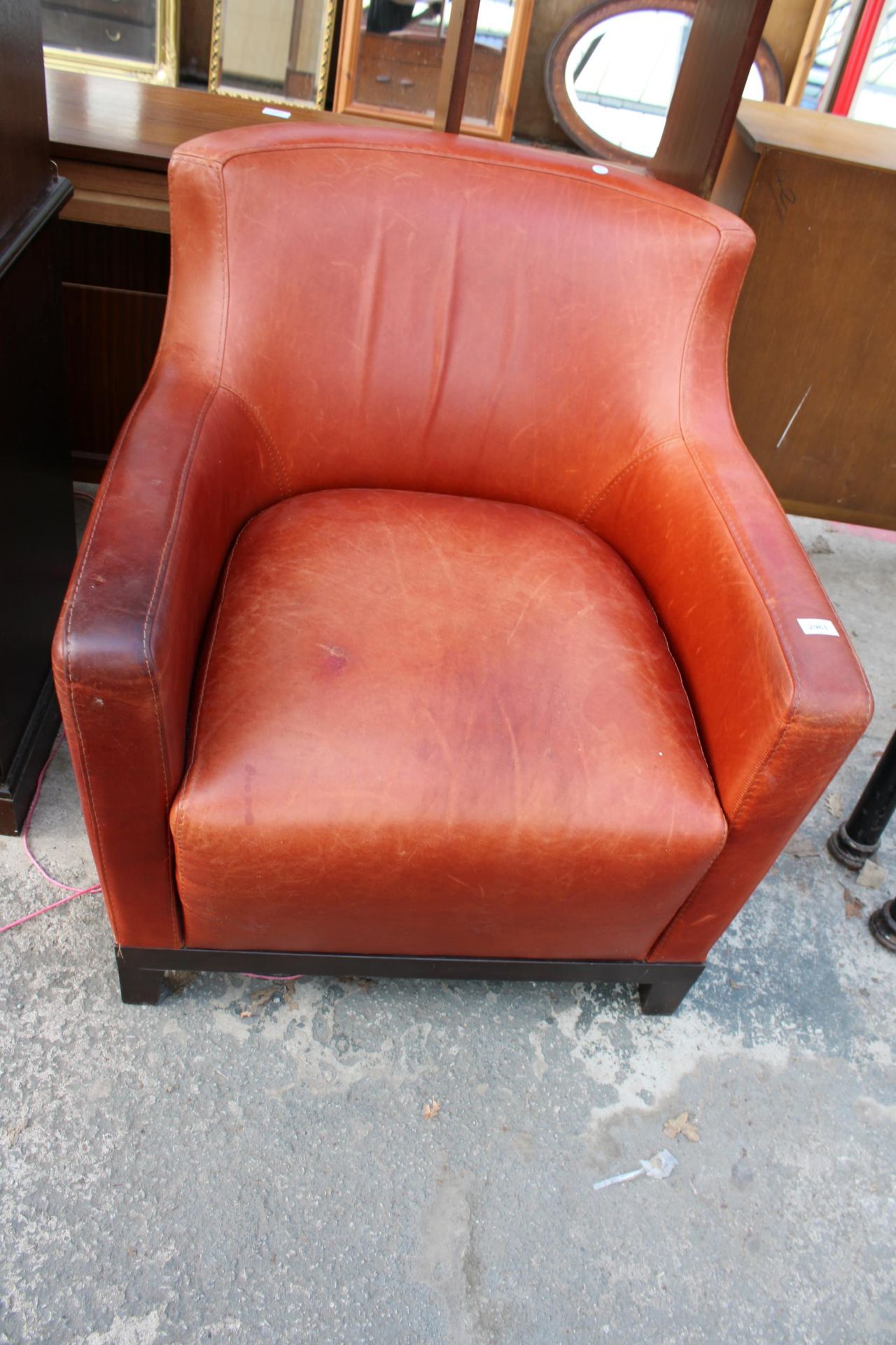 A CALIATALIA LEATHER LOUNGE CHAIR