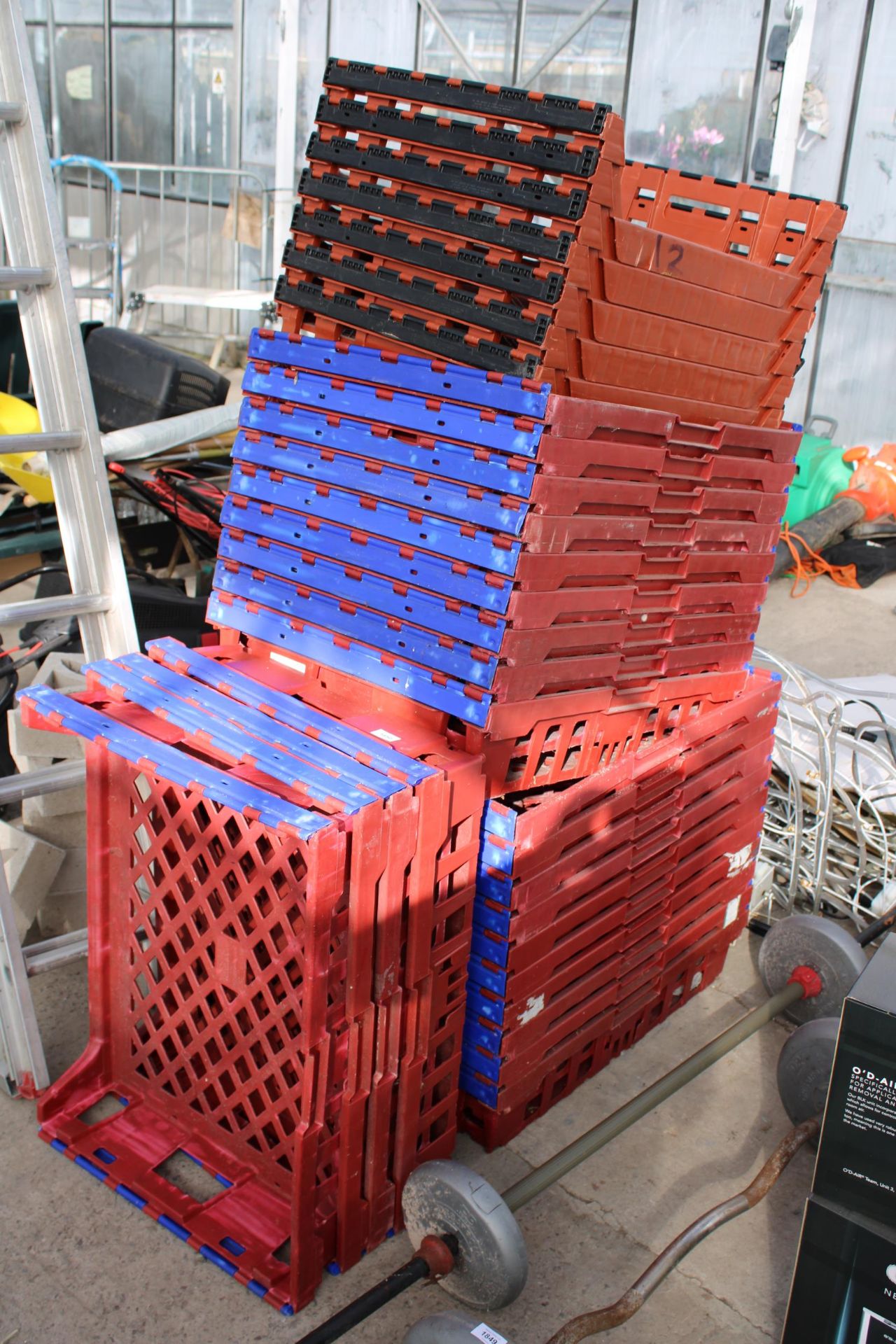 A LARGE QUANTITY OF PLASTIC STACKING TRAYS