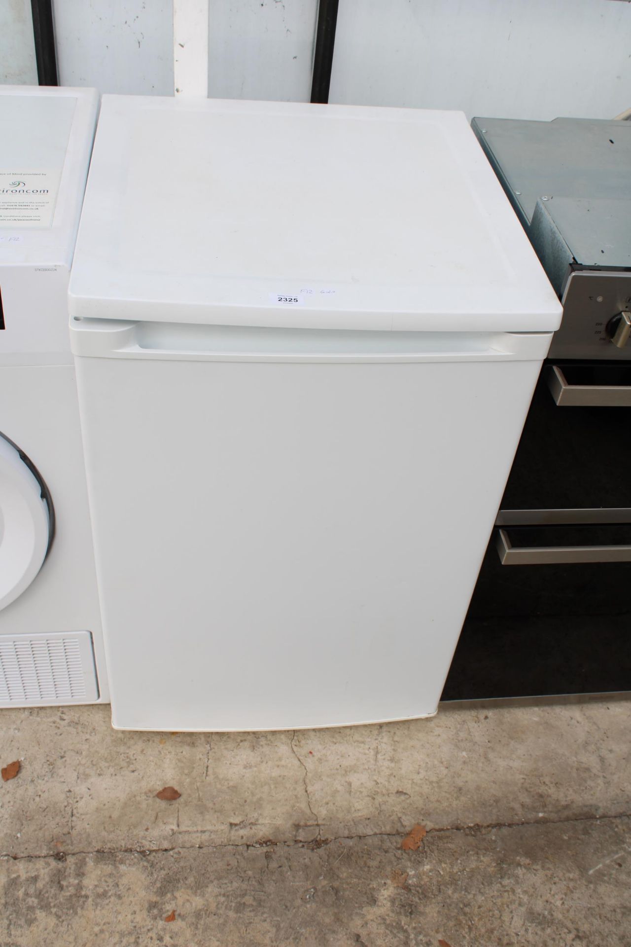 A WHITE UNDERCOUNTER FRIDGE BELIEVED IN WORKING ORDER BUT NO WARRANTY