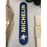 A CAST BLUE AND YELLOW MICHELIN SIGN