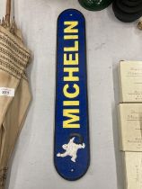 A CAST BLUE AND YELLOW MICHELIN SIGN