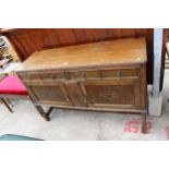 AN EARLY TWENTIETH CENTURY OAK SIDEBOARD ON BARLEY TWIST FRONT LEGS, 54" WIDE