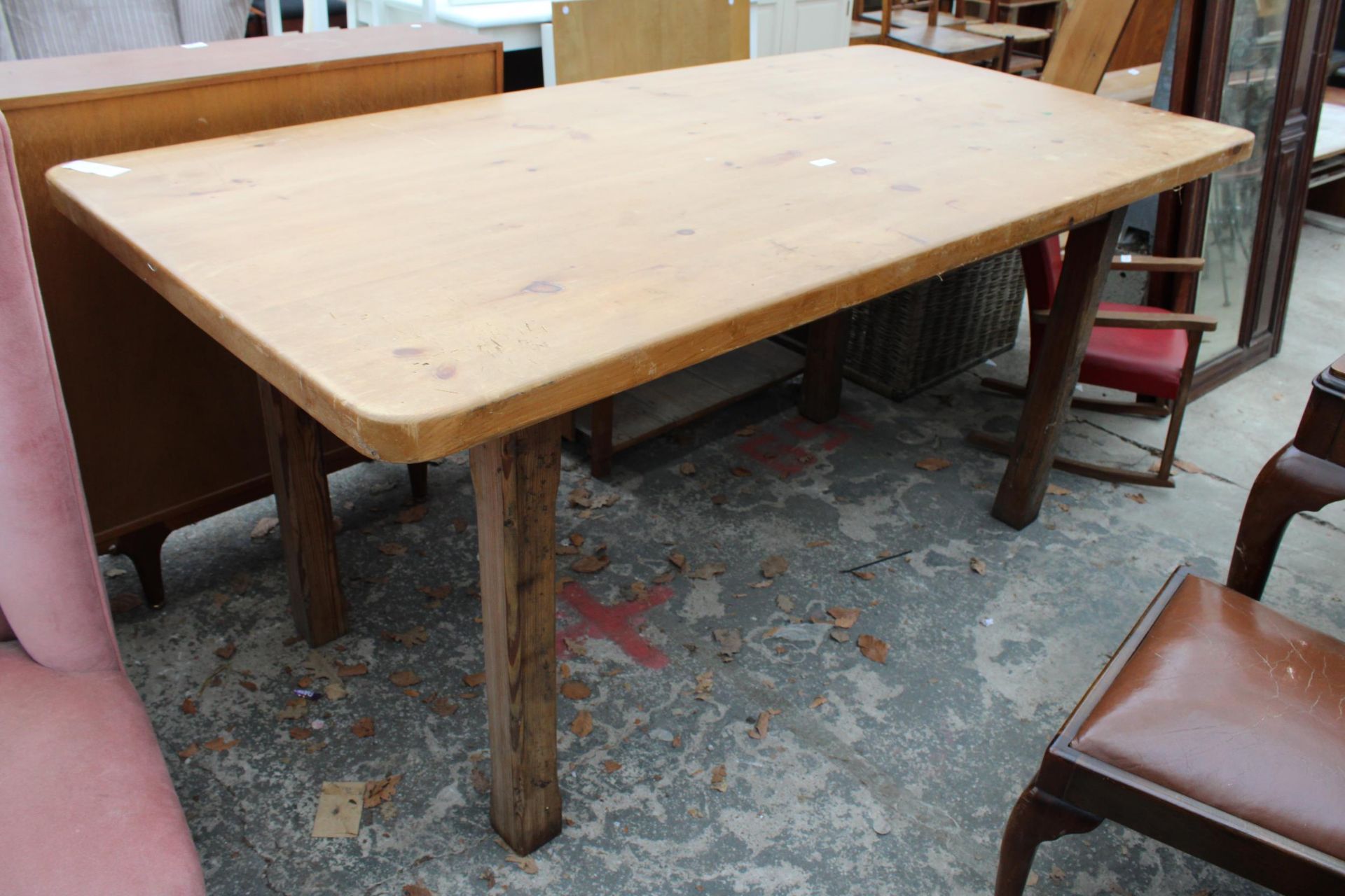 A PITCH PINE KITCHEN TABLE BASE WITH LATER TOP 72" X 36"