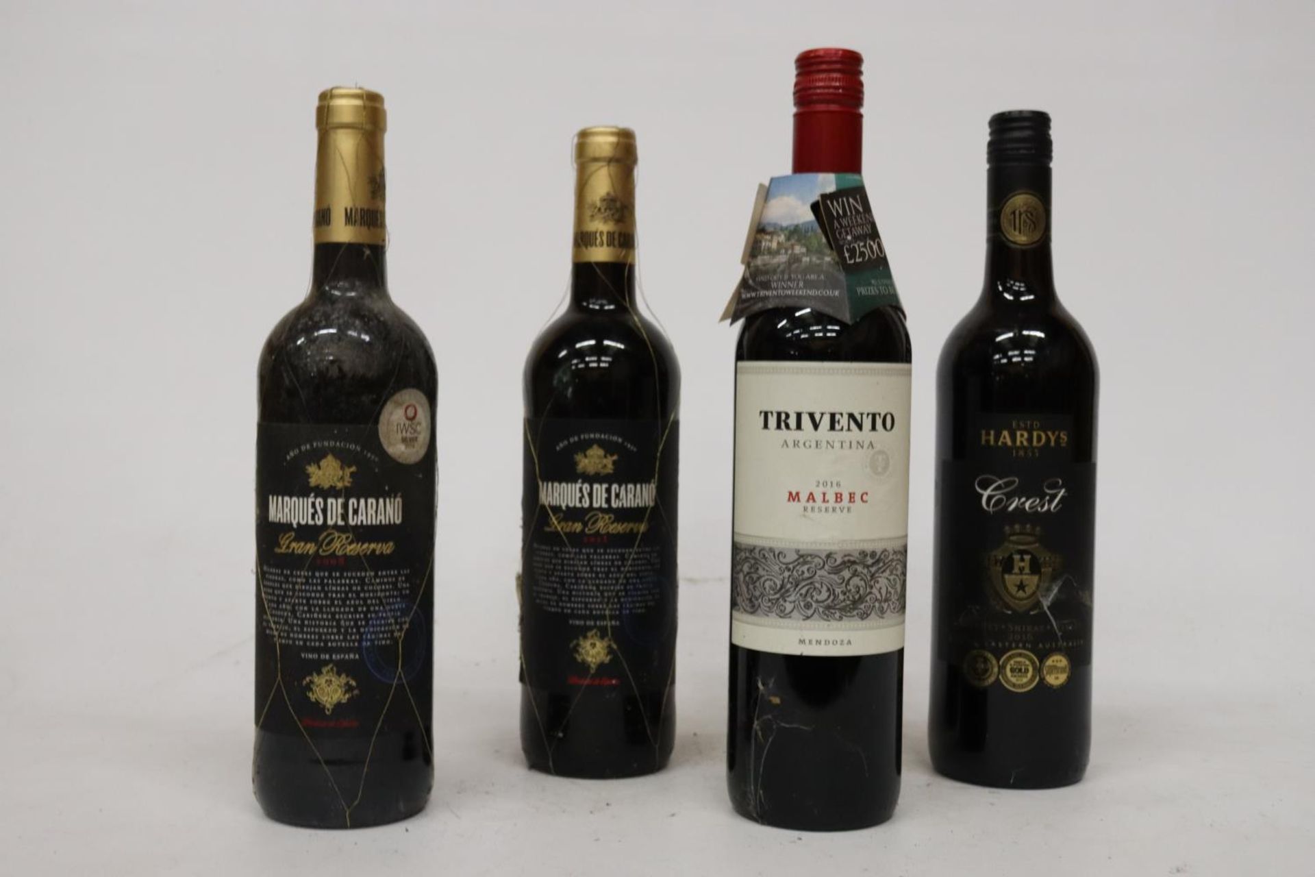 FOUR MIXED RED WINES TO INCLUDE TWO BOTTLES OF MARQUES DE CARANO GRAN RESERVA 2011, TRIVENTO