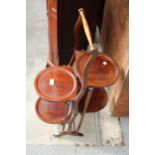 AN EDWARDIAN FOUR TIER FOLDING MAHOGANY AFTERNOON TEA STAND